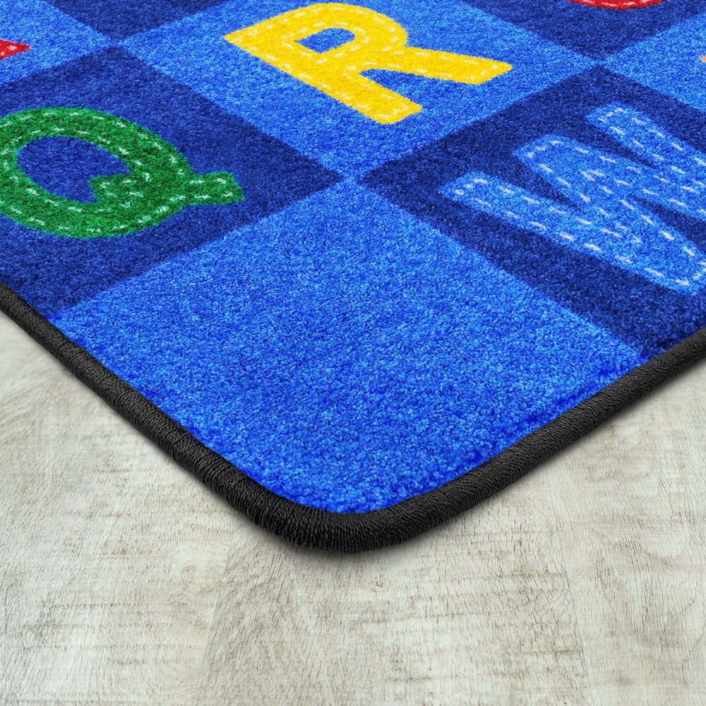 Kid Essentials Patchwork Letters 7'8" x 10'9" Area Rug in Color Multi