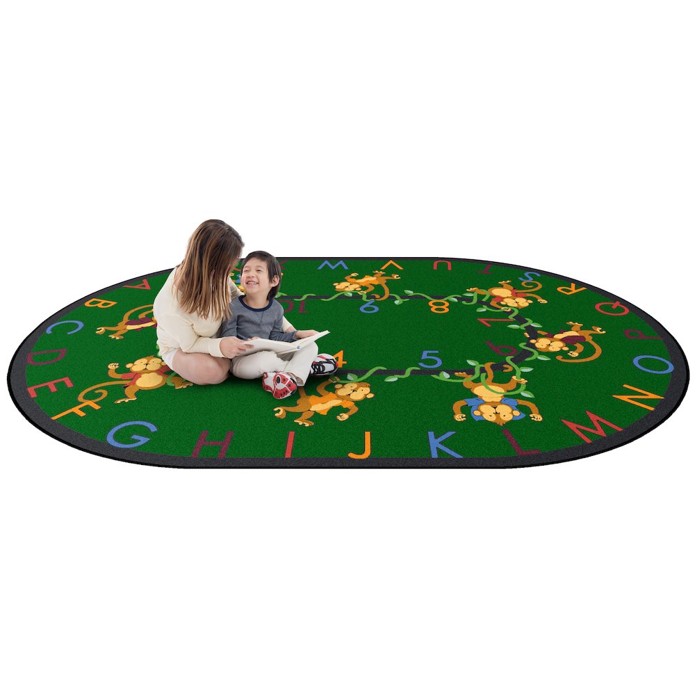 Kid Essentials Monkey Business 10'9" x 13'2" Oval Area Rug in Color Green
