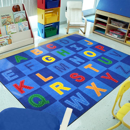 Kid Essentials Patchwork Letters 10'9" x 13'2" Area Rug in Color Multi
