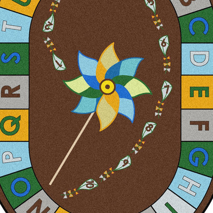 Kid Essentials Alphabet Pinwheel 10'9" x 13'2" Oval Area Rug in Color Earthtone