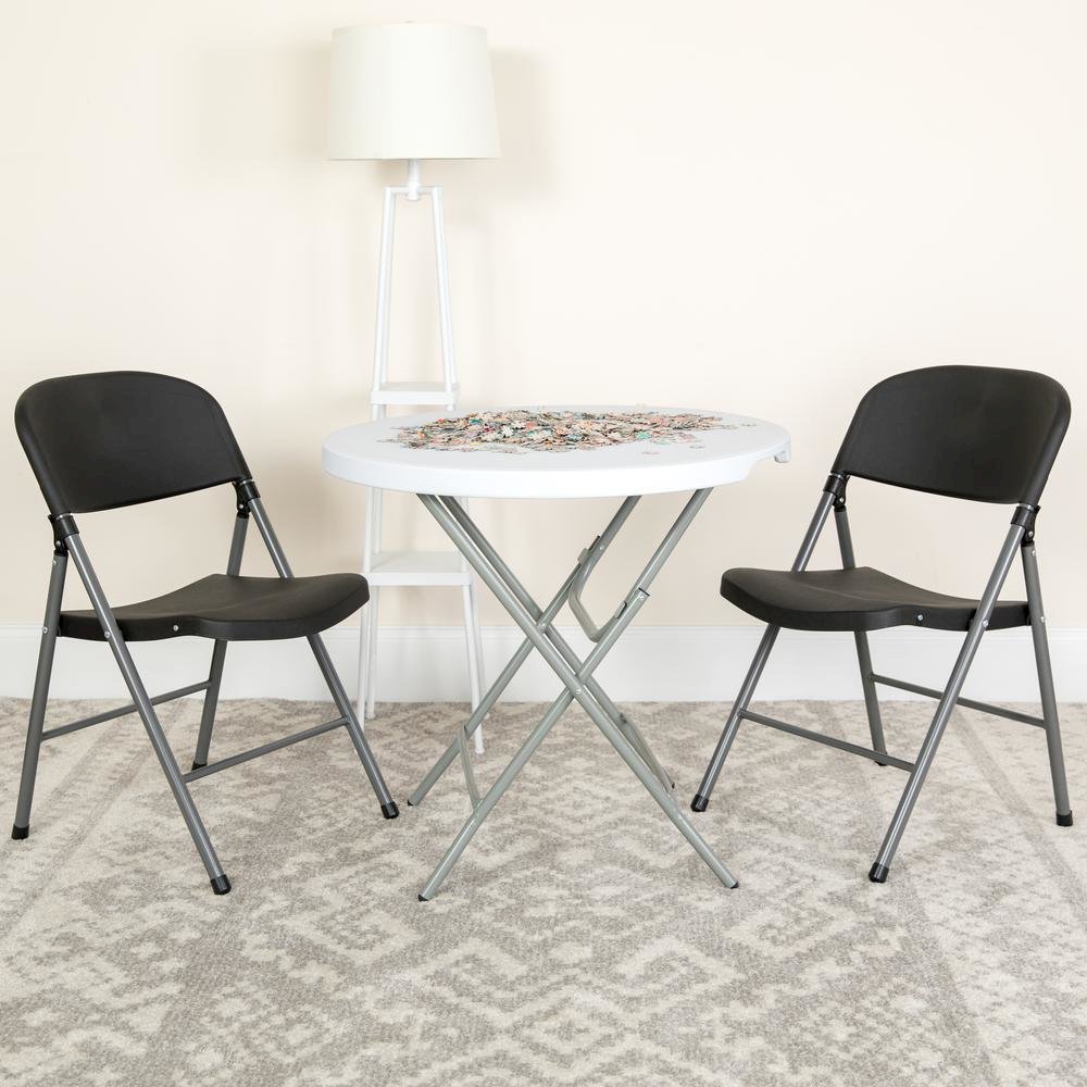 HERCULES Series 330 lb. Capacity Black Plastic Folding Chair with Charcoal Frame