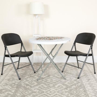 HERCULES Series 330 lb. Capacity Black Plastic Folding Chair with Charcoal Frame
