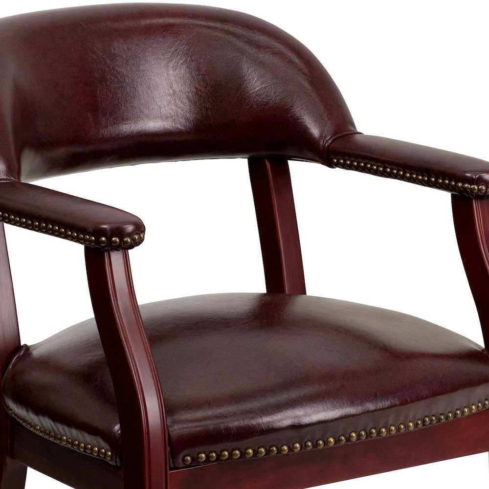 Oxblood Vinyl Luxurious Conference Chair with Accent Nail Trim and Casters