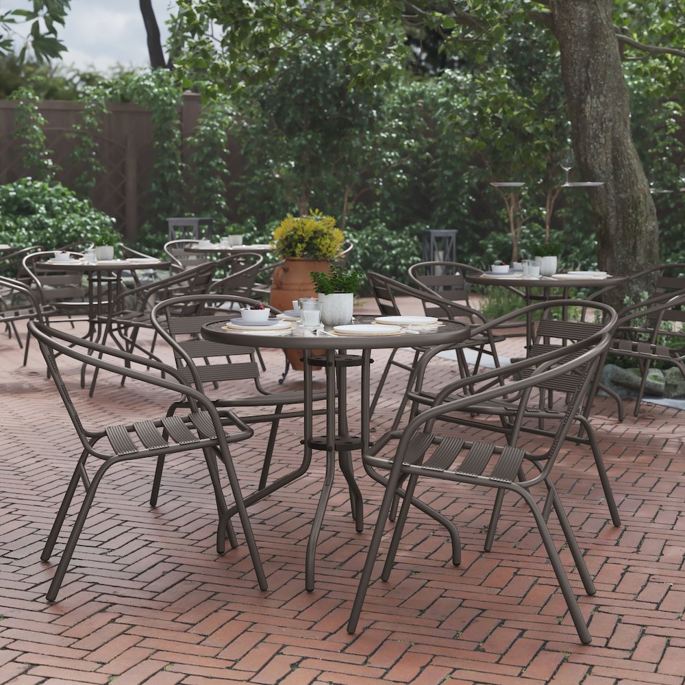 Lila 31.5'' Round Glass Top Metal Table with 4 Bronze Aluminum Slat Stack Chairs
