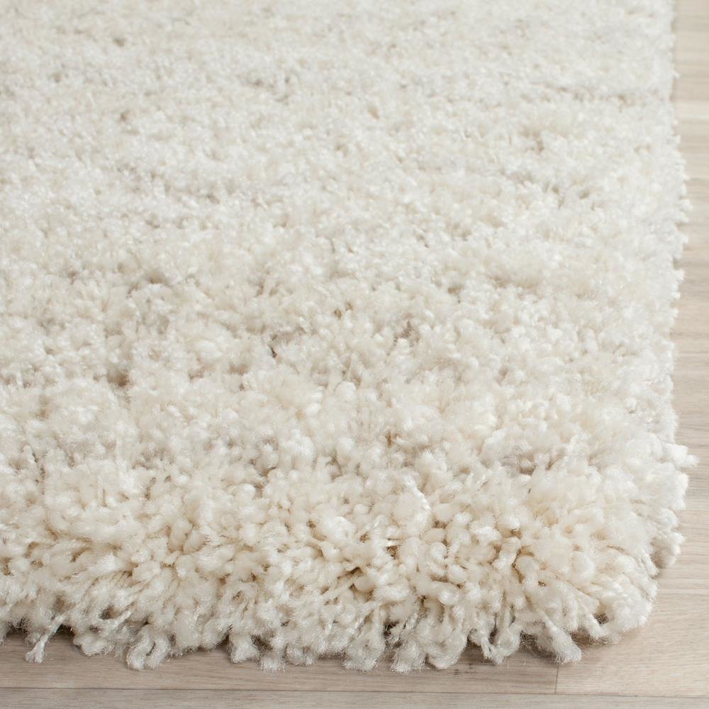 Beige Ivory Area Rug with Power Loomed Construction and Medium Rectangle Shape