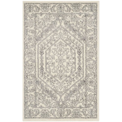 Ivory and Silver Area Rug with Power Loomed Polypropylene Pile for Accent Spaces