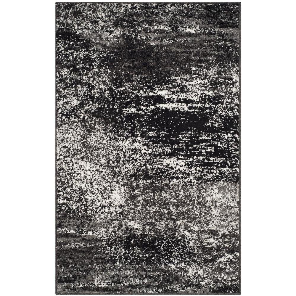 Gray and Black Area Rug with Power Loomed Polypropylene Pile for Accent Spaces