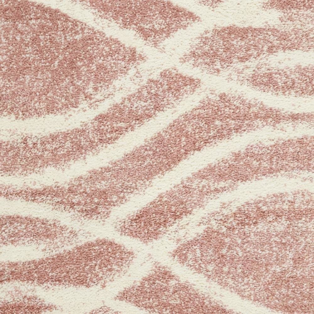 Cream and rose area rug with power loomed polypropylene pile in accent shape