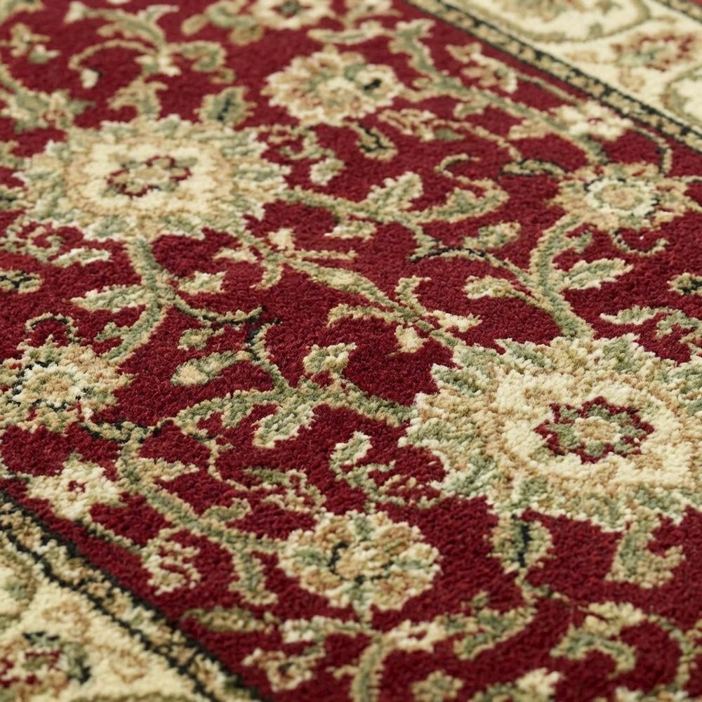 Red and ivory area rug with power loomed polypropylene pile, runner size