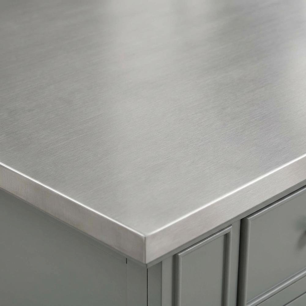 Gray kitchen island with stainless steel accents and anti-tip safety