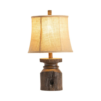 Brown Resin Lamp With Carved Base And Tan Shade