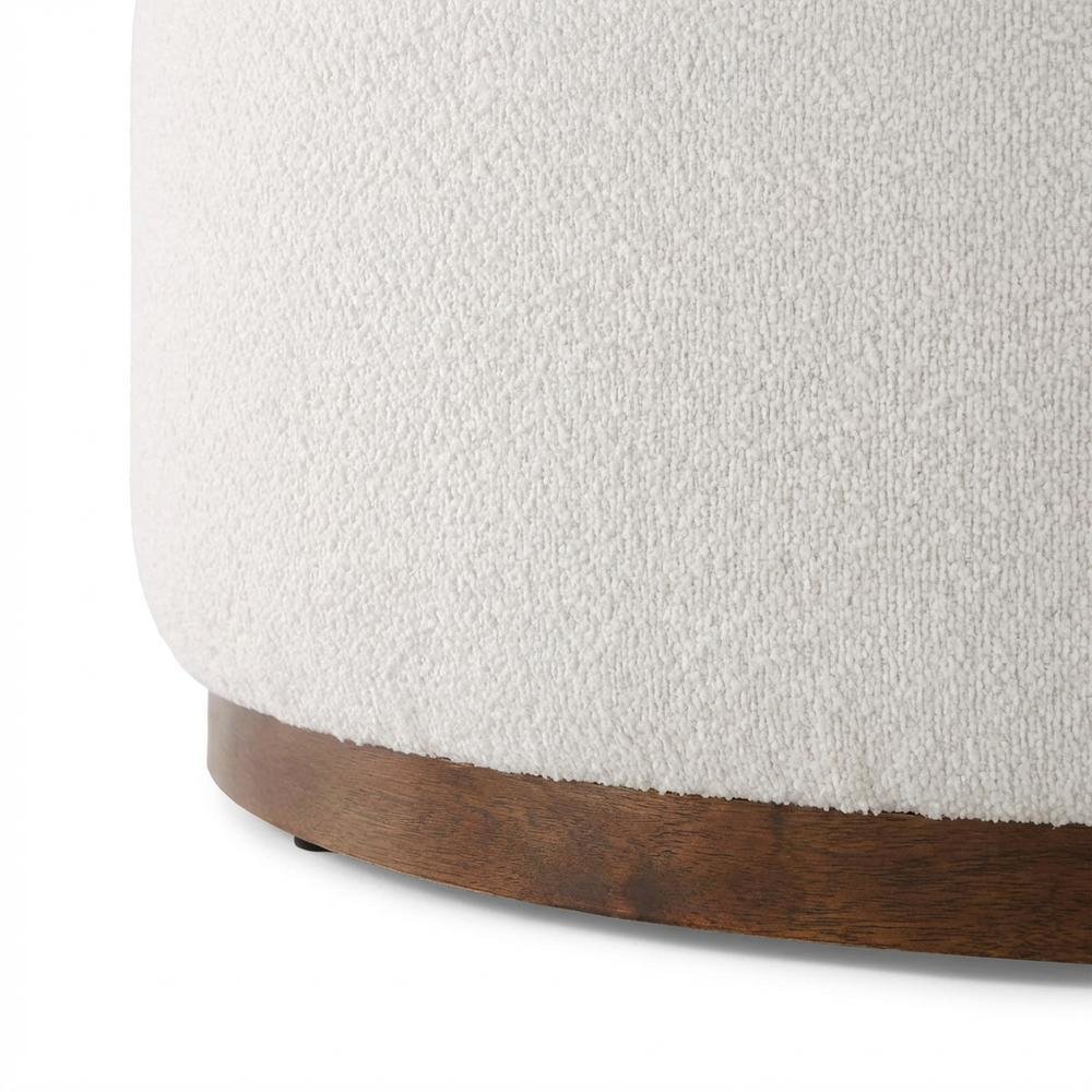 Round boucle upholstered outdoor ottoman with cushioned top, modern design