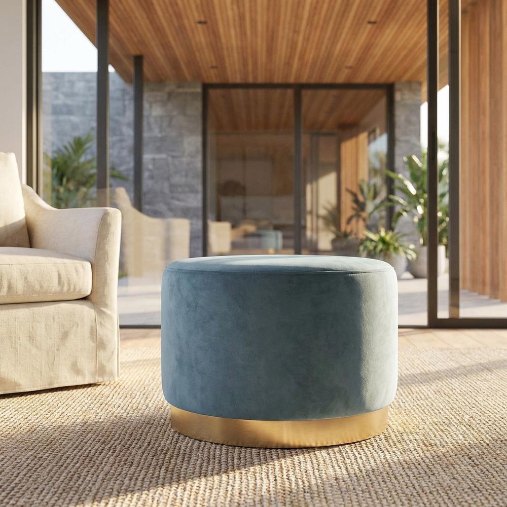 Round performance velvet ottoman with plush upholstery and versatile design