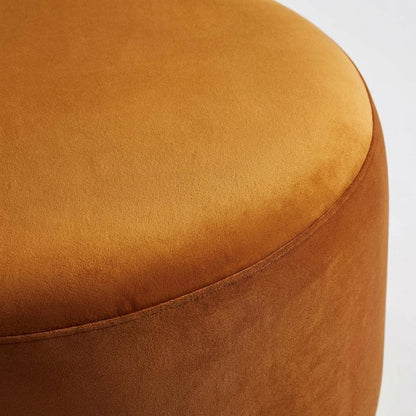 Performance velvet outdoor ottoman with round design and cushioned top
