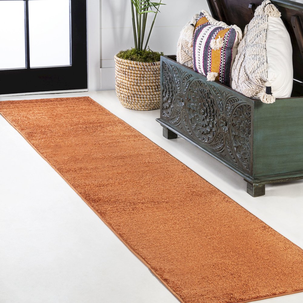 Haze Solid Low Pile Area Rug Orange