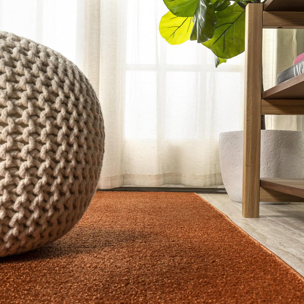 Haze Solid Low Pile Area Rug Orange