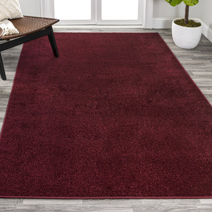 Haze Solid Low Pile Area Rug Dark Red