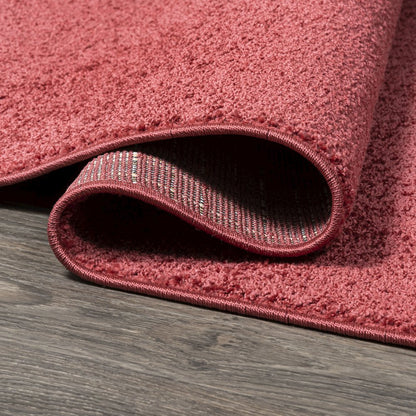 Haze Solid Low Pile Area Rug Red