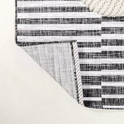 Sukie Modern Offset Stripe Indoor/Outdoor Area Rug