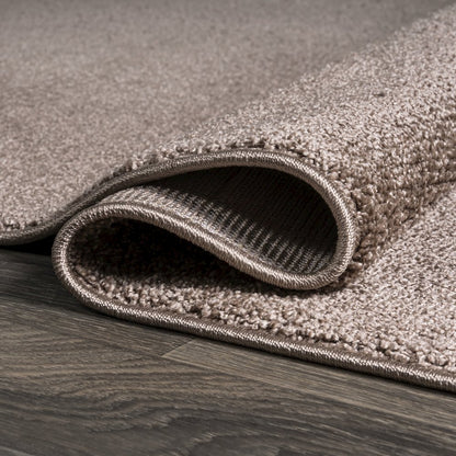 Haze Solid Low Pile Area Rug Brown