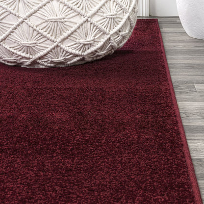 Haze Solid Low Pile Area Rug Dark Red