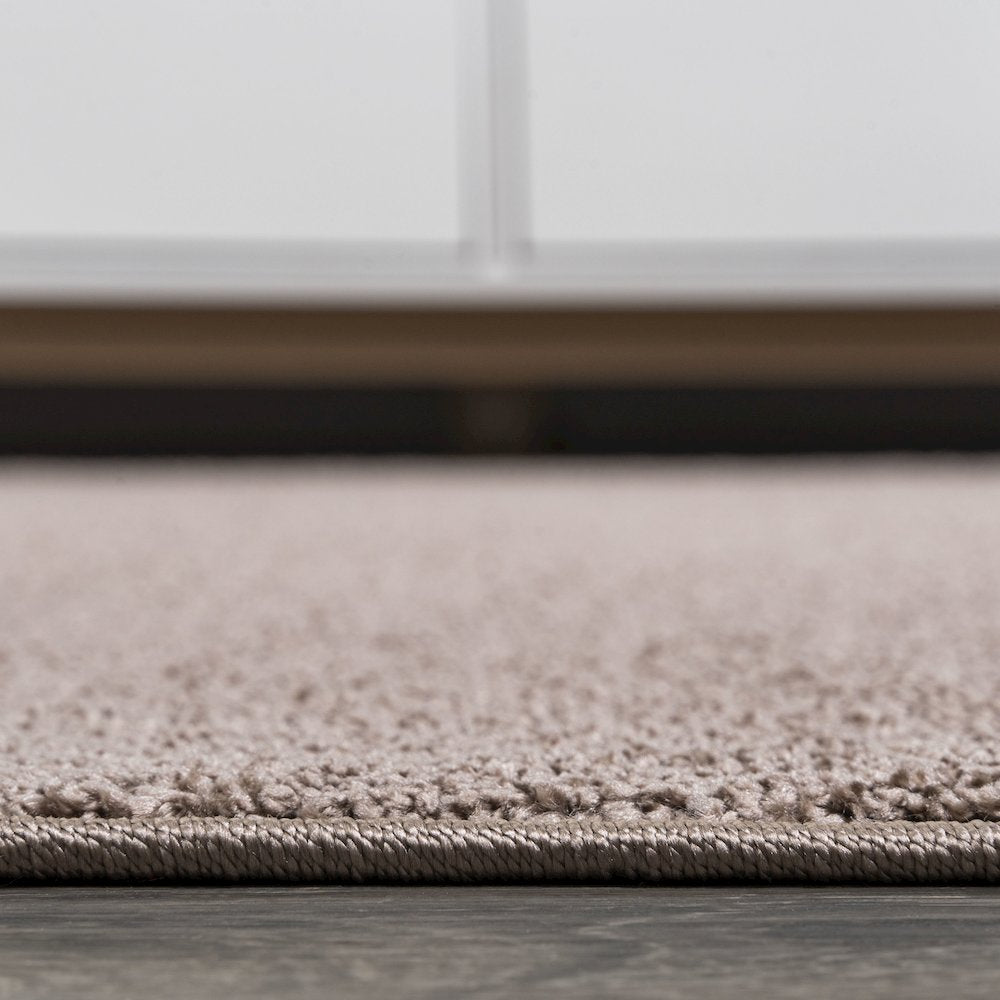 Haze Solid Low Pile Area Rug Brown