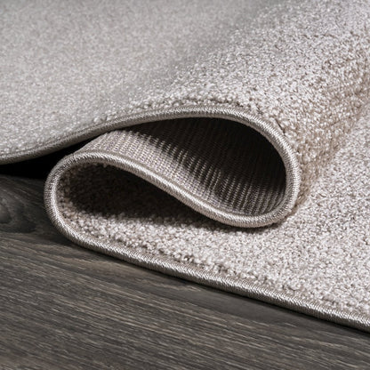 Haze Solid Low Pile Area Rug Beige