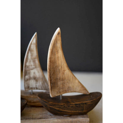 Five Wooden Sail Boats On A Base