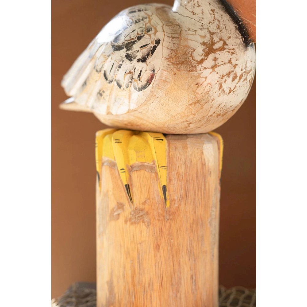 Carved Wooden Pelican On A Piling