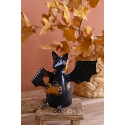 Recycled Metal Bat Holding A Pumpkin