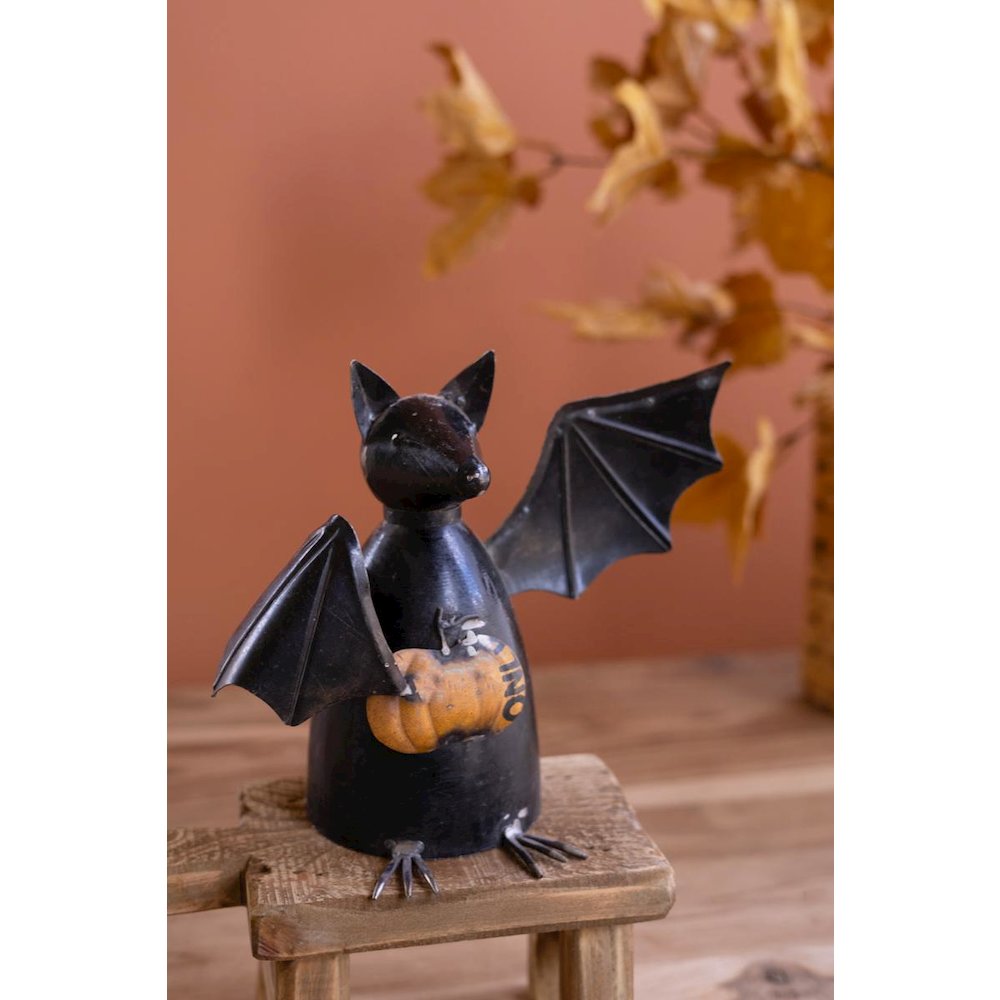 Recycled Metal Bat Holding A Pumpkin