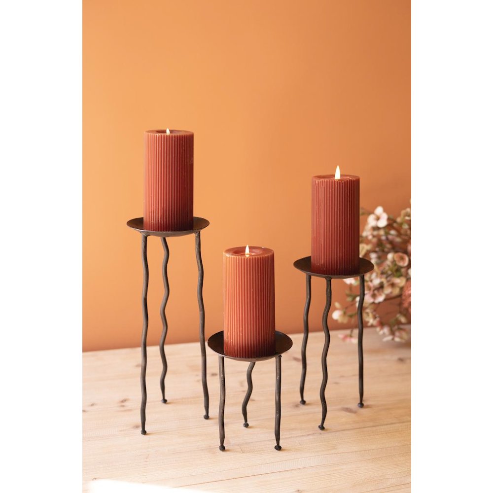 Set Of Three Rustic Metal Candle Stands With Wavy Legs