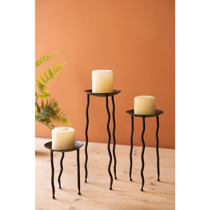 Set Of Three Rustic Metal Candle Stands With Wavy Legs
