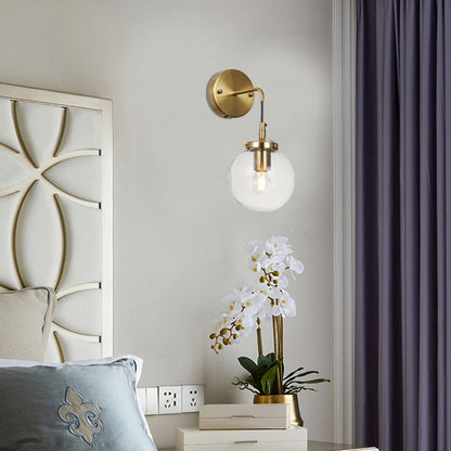 1-Light Brass Wall Sconce With A Clear Glass Globe Shade
