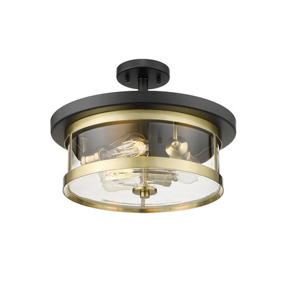 3-Light Black And Gold Flush Mount With A Clear Glass Shade