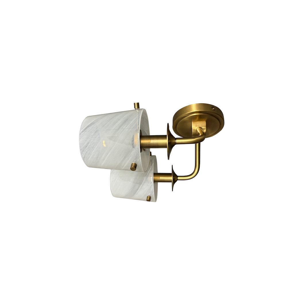 Double brushed brass sconce with curved arm and white swirl glass