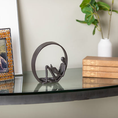 Encircled Reader Iron Sculpture