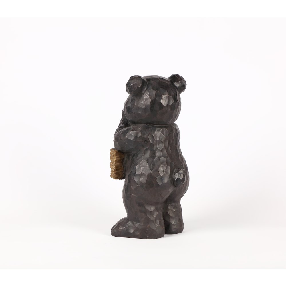 Bear Leans On Welcome Sign