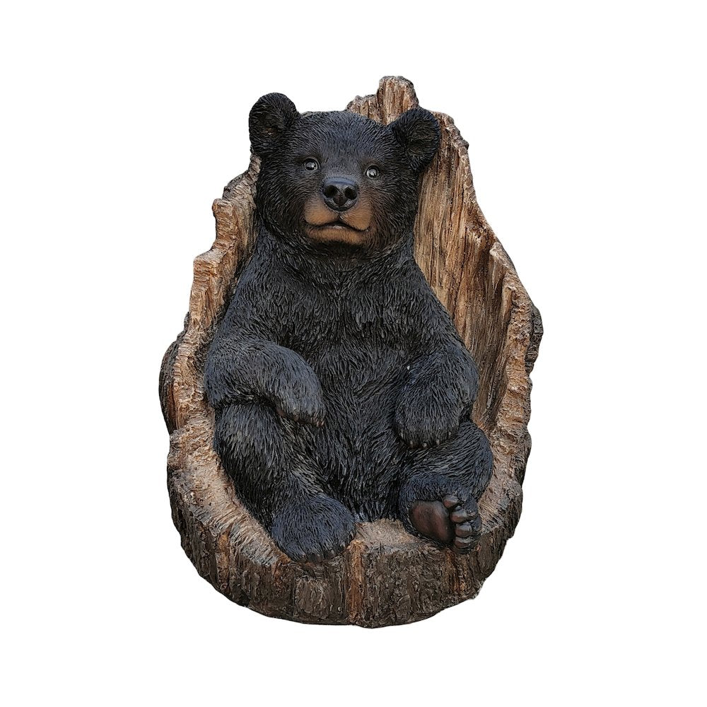 Lone Cub Haven: Intriguing Black Polyresin Bear in Stump Figurine