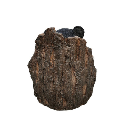 Lone Cub Haven: Intriguing Black Polyresin Bear in Stump Figurine