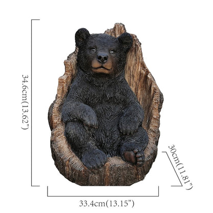 Lone Cub Haven: Intriguing Black Polyresin Bear in Stump Figurine