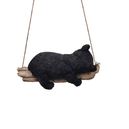 Suspended Cub Serenity: Striking Black Hanging Bear Polyresin Figurine