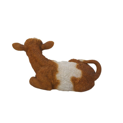 Brown & White Cow Laying Down
