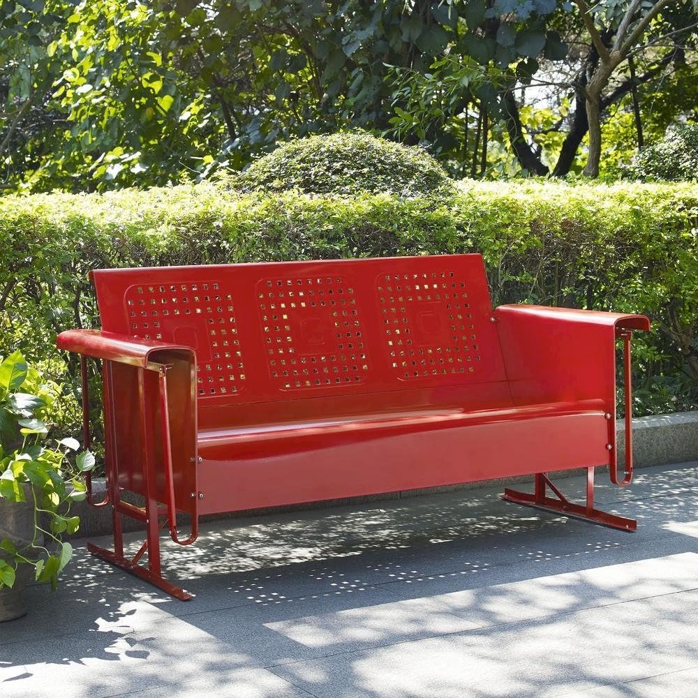 Red outdoor sofa glider with sturdy frame and comfortable seating for three