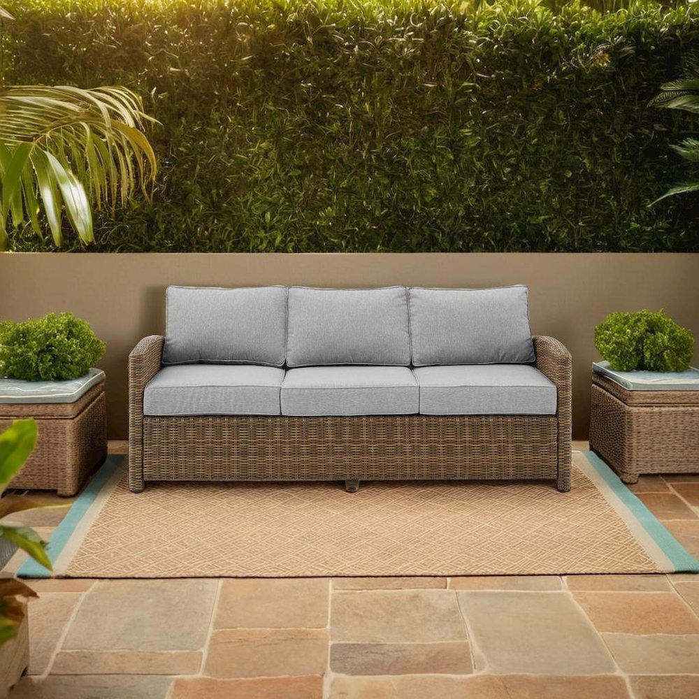 Elegant Gray Wicker Outdoor Sofa with Weather-Resistant Cushion Covers